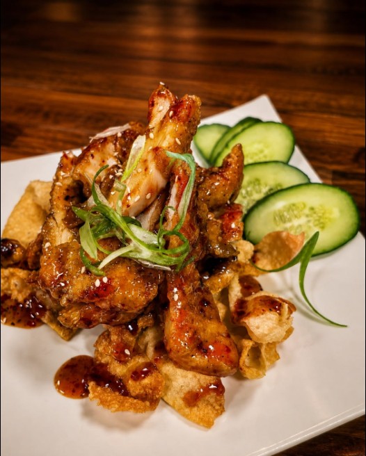 Glazed bites with cucumber slices and green onion